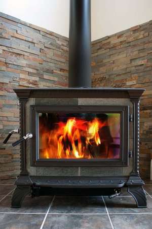 Cast Iron Wood Stove Burning Hot with Slate Tile Journal de Cool Image