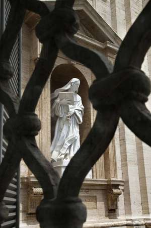 Statue of Saint Teresa of Avila Viewed Through a Wrought Iron Fence Journal de Cs Creations